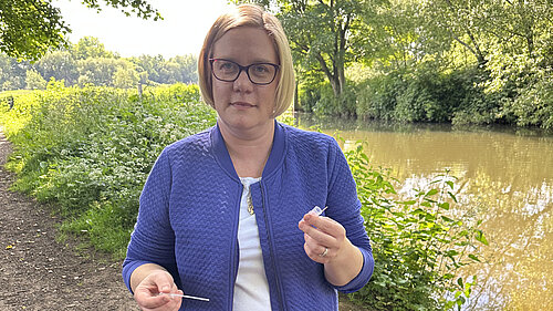 Zöe Franklin testing water from the River Wey