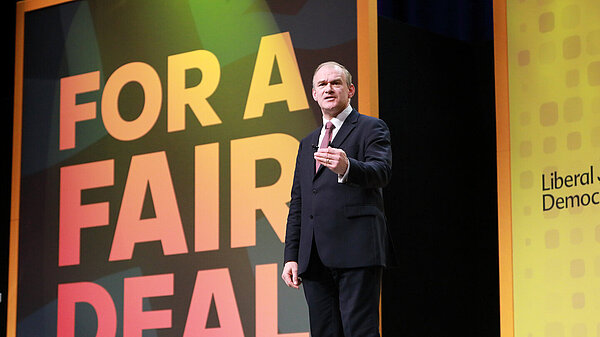 Ed Davey talking on stage at the Liberal Democrat Conference